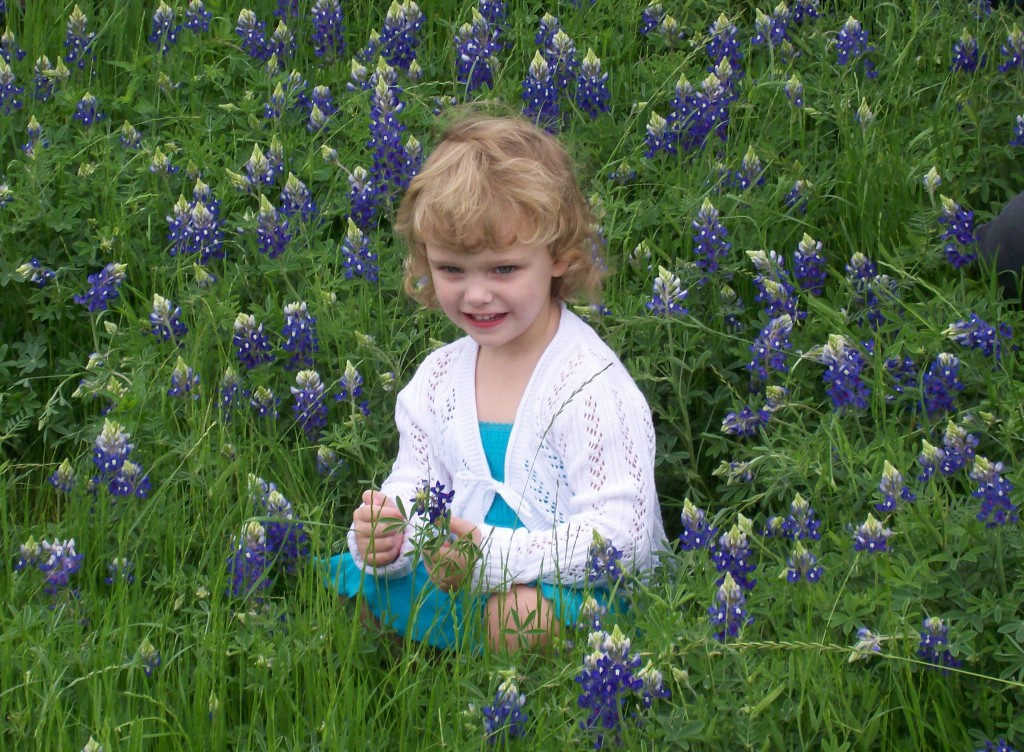 Niece in field of bluebonnets. Copyright Kathy Carmichael.